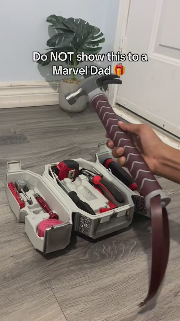 Toolgokit hammer-shaped tool case held upright like Thor's hammer